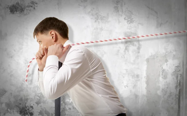 Businessman pulling a rope — Stock Photo, Image