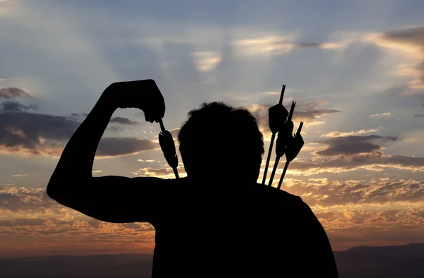 Silhouette of a witch-hunter of arrows — Stock Photo, Image