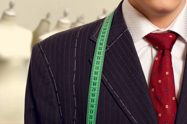 Businessman getting measured by a tailor — Stock Photo, Image