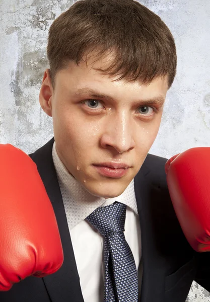 Businessman in red boxing gloves — Stock Photo, Image