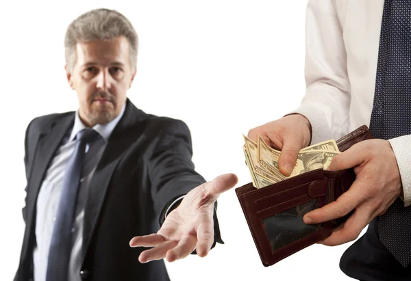 Businessman taking bribe over white background. — Stock Photo, Image