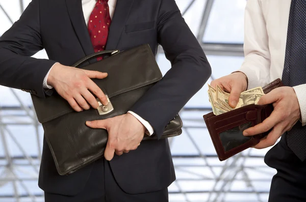 Businessman taking bribe — Stock Photo, Image