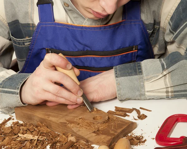 Craftsman in uniform working at carpentry — ストック写真