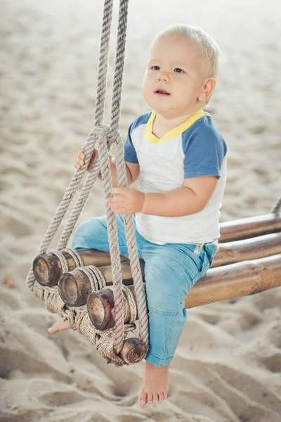 Baby on a swing — Stock Photo, Image