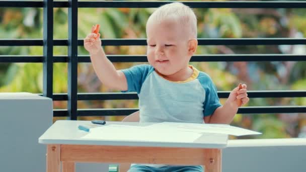 Toddler boy practice to paint with crayons — Stock Video