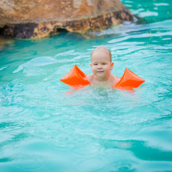 Baby with armbands — Stock Photo, Image