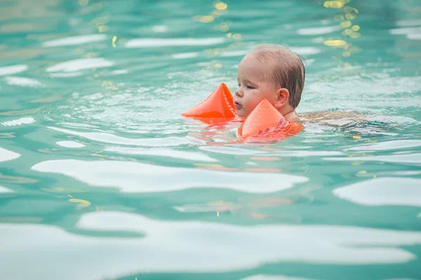 Baby with armbands — Stock Photo, Image