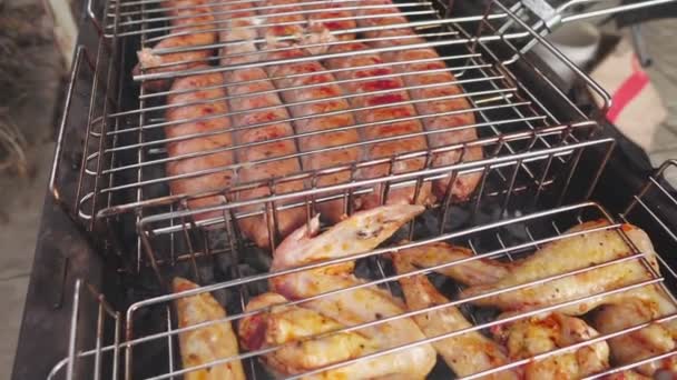 Cooking outdoors barbecue — Stock Video