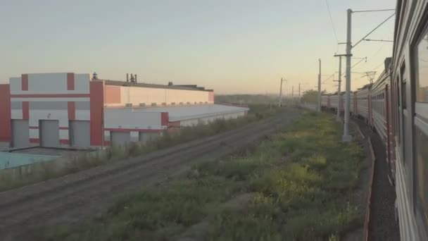 Suburban train at sunset — Stock Video