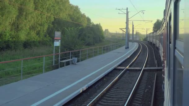 Suburban train at sunset — Stock Video
