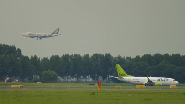 Boeing 737 of Air Baltic taxiing the runway — Wideo stockowe