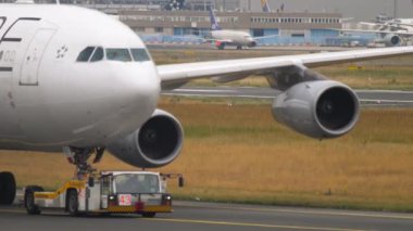 Airbus A340 at the airport taxiing, close-up