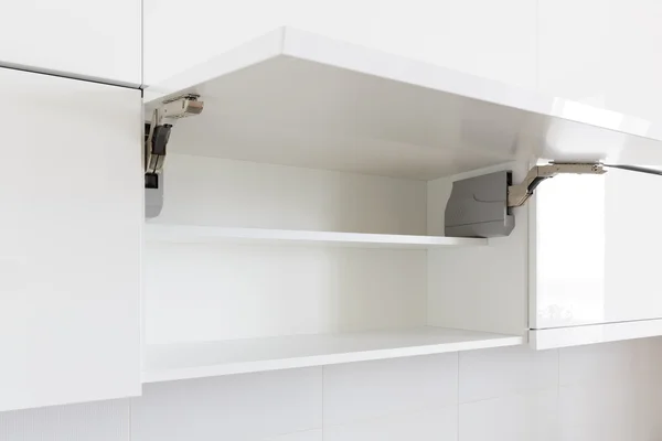 Opened kitchen cabinet — Stock Photo, Image