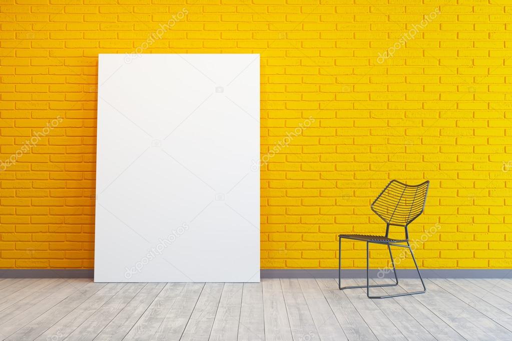 yellow room with blank picture and chair