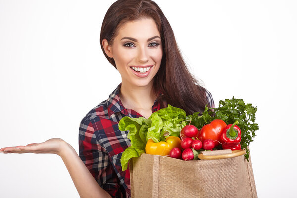 woman with grocery bag and vegetables