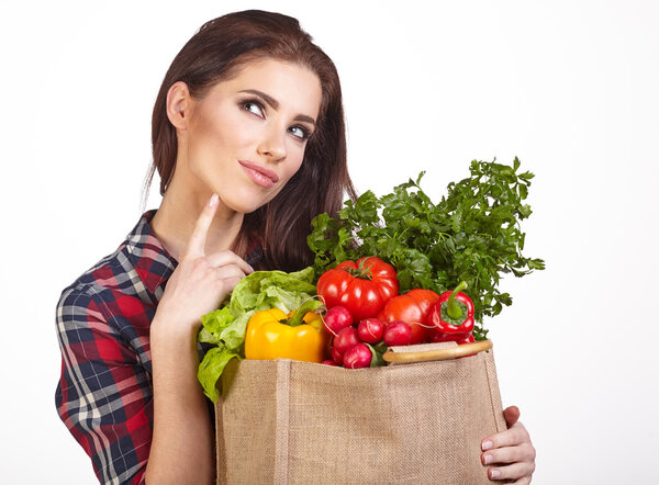 woman with grocery bag and vegetables