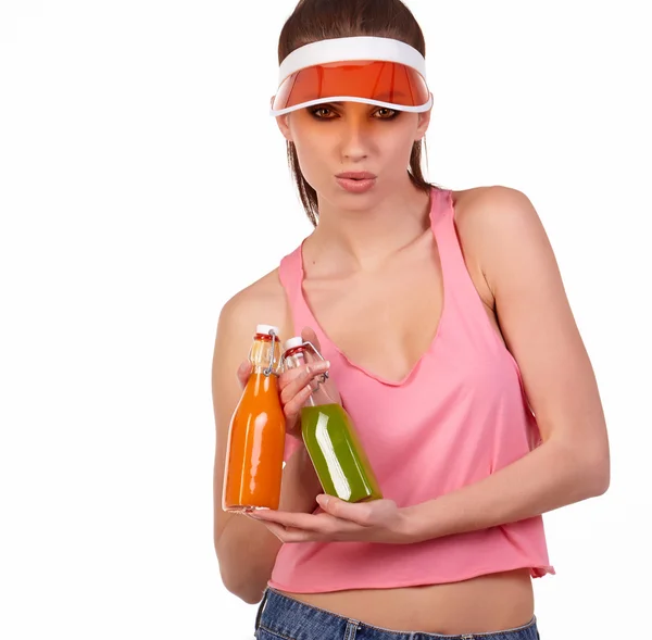 Woman in pink top holding bottles — Stock Photo, Image