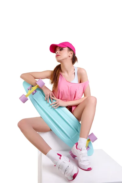 Fashion hipster girl with skateboard — Stock Photo, Image