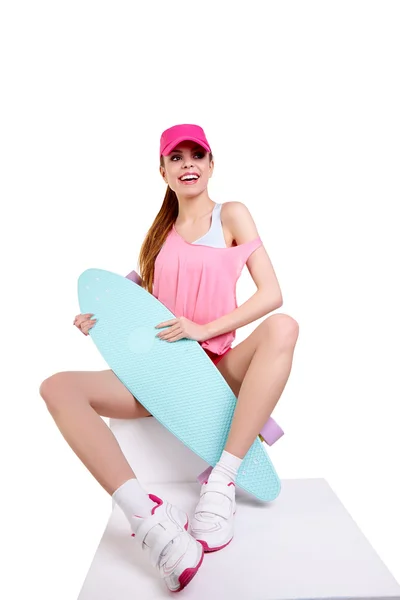 Fashion hipster girl with skateboard — Stock Photo, Image