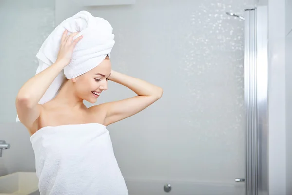 Woman wrapped in white towels — Stock Photo, Image