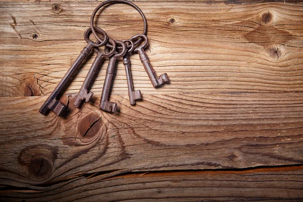 Medieval keys on wood table — Stock Photo, Image