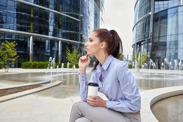 Businesswoman with disposable coffee cup — Stock Photo, Image