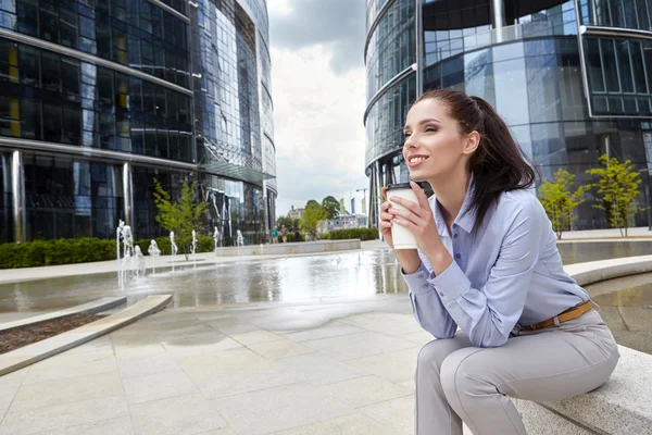 Businesswoman with disposable coffee cup — Stock Photo, Image