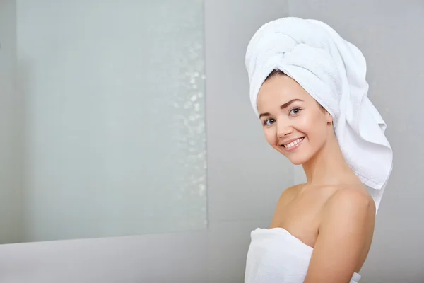 Woman wrapped in white towels — Stock Photo, Image