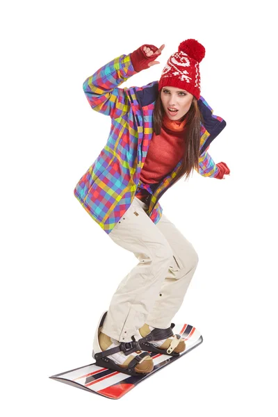 Молодая женщина на сноуборде — стоковое фото