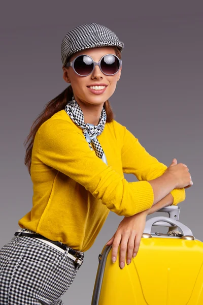 Woman with yellow suitcase — Stock Photo, Image