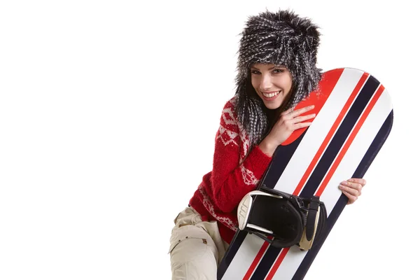 Hermosa mujer con una tabla de snowboard — Foto de Stock