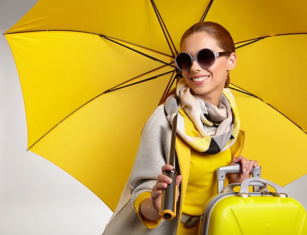 Glamour woman under yellow umbrella — Stock Photo, Image