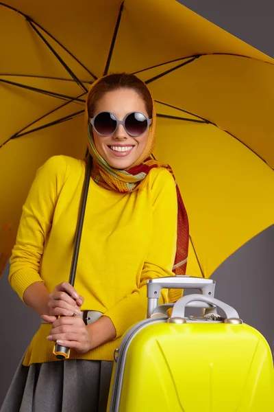 Glamour woman under yellow umbrella — Stock Photo, Image