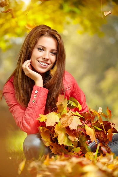 Woman in a park in autumn Royalty Free Stock Photos