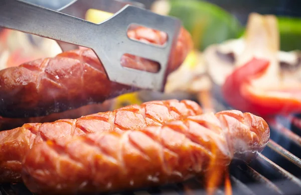 Grilling Sausages on barbecue grill — Stock Photo, Image