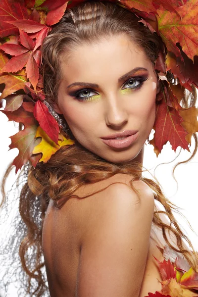 Woman dressed in red leaves — Stock Photo, Image