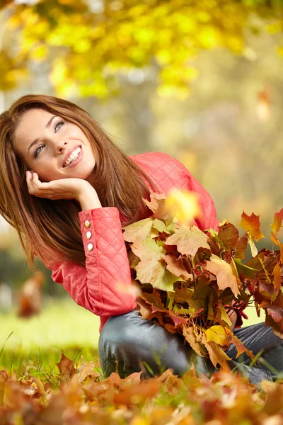 Woman in forest in fall colors Stock Photo