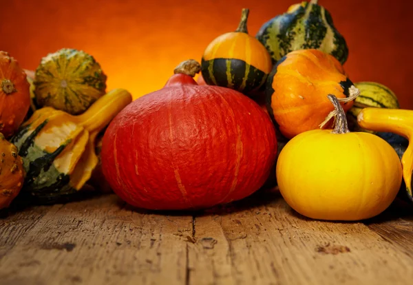 Pumpkins on wooden table — Stock Photo, Image