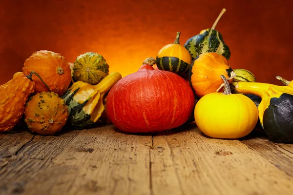 Pumpkins on wooden table — Stock Photo, Image