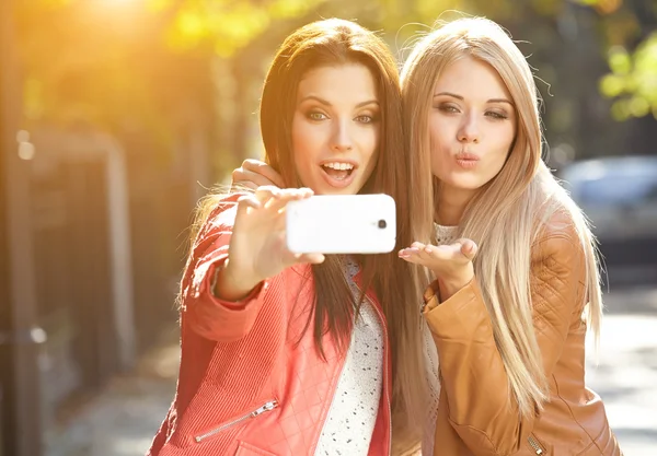 Beautiful young women making selfie — Stock Photo, Image
