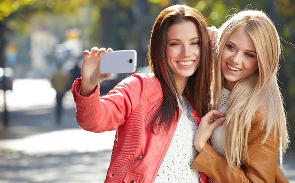 Beautiful young women making selfie — Stock Photo, Image