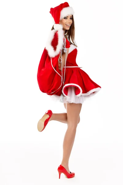 Menina vestindo roupas de Papai Noel com presentes — Fotografia de Stock