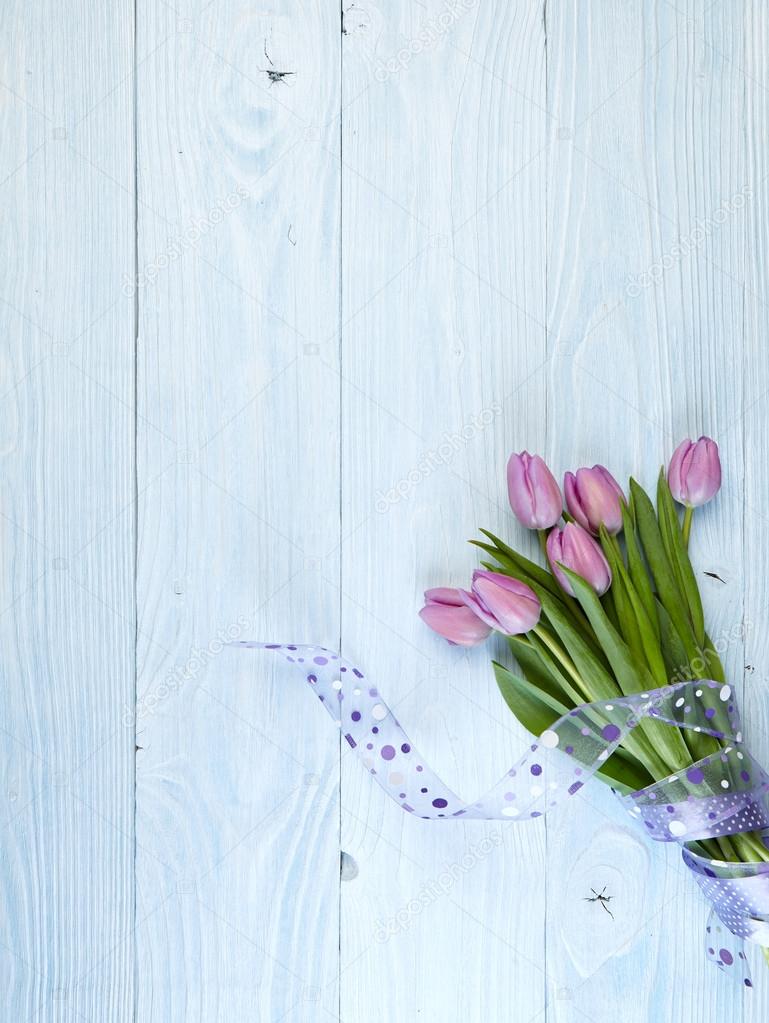 Purple tulips  on old used wood 