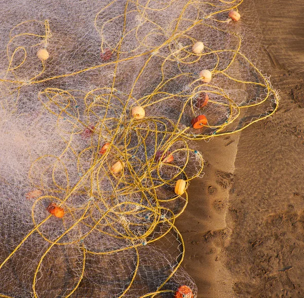 Fishing nets on the sand — Stock Photo, Image