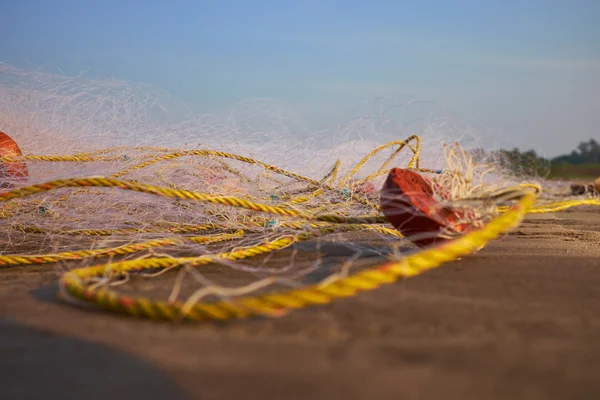 Fishing nets on the sand — Stock Photo, Image