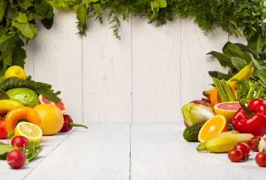 Fruit and vegetable borders on wooden table clipart