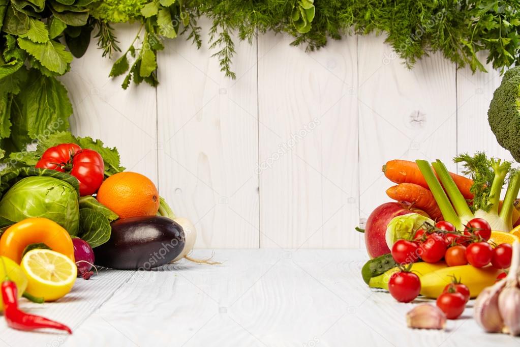 Fruit and vegetable borders on wooden table