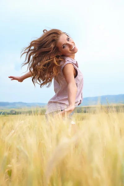 Woman in golden wheat Royalty Free Stock Images