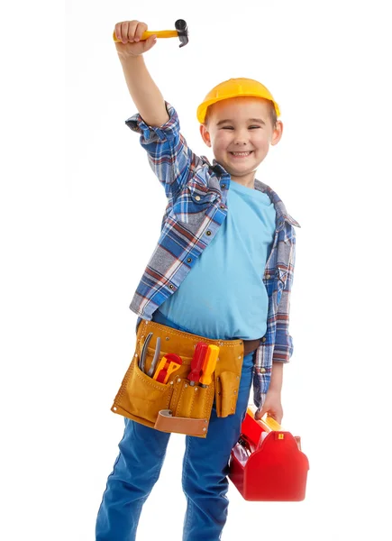 Liten pojke spelar byggnadsarbetare. isolerad på vit — Stockfoto