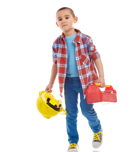 Kleiner Junge spielt Bauarbeiter. isoliert auf weiß — Stockfoto